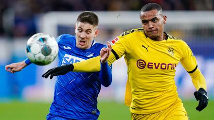 Sieger und Verlierer. Hoffenheims Andrej Kramaric (l.) schießt seine Elf zum 2:1-Erfolg, Dortmunds Manuel Akanji geht leer aus.
