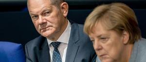 Was tun mit den Milliarden? Finanzminister Olaf Scholz (SPD) und Bundeskanzlerin Angela Merkel (CDU)