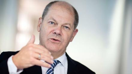 Olaf Scholz garniert seinen Gesetzesvorschlag für eine Finanztransaktionssteuer mit großen Versprechungen. 