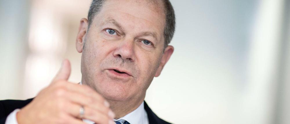Olaf Scholz garniert seinen Gesetzesvorschlag für eine Finanztransaktionssteuer mit großen Versprechungen.