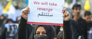 Diese irakische Demonstrantin fordert Rache für den Tod des iranischen Militärkommandanten Qasem Soleimani.