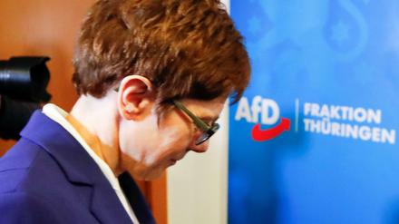 Annegret Kramp-Karrenbauer, chairwoman of Germany&amp;apos;s conservative Christian Democratic Union party CDU walks past a sign of Germany&amp;apos;s far-right Alternative for Germany (AFD) party following a meeting at the federal parliament of the state of Thuringia in Erfurt, Germany February 7, 2020. REUTERS/Wolfgang Rattay