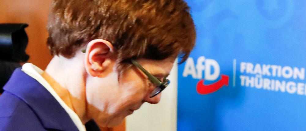 Annegret Kramp-Karrenbauer, chairwoman of Germany's conservative Christian Democratic Union party CDU walks past a sign of Germany's far-right Alternative for Germany (AFD) party following a meeting at the federal parliament of the state of Thuringia in Erfurt, Germany February 7, 2020. REUTERS/Wolfgang Rattay