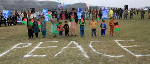 Afghanische Kinder feiern im Vorfeld der erwarteten Unterzeichnung des Abkommens zwischen den USA und den Taliban.