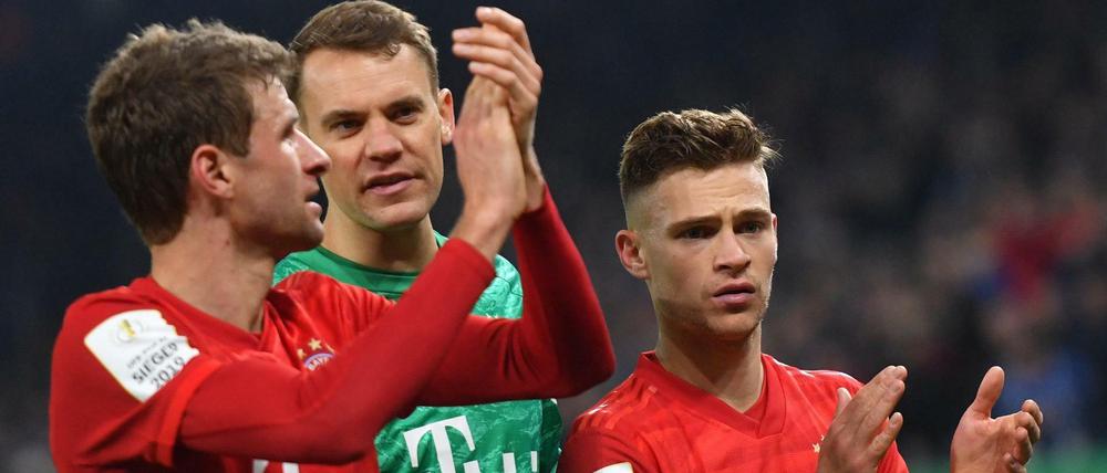 Geldverteiler. Die Münchner Thomas Müller, Torhüter Manuel Neuer und Joshua Kimmich.
