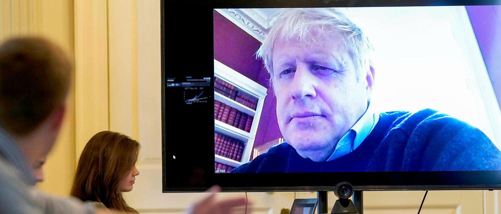 Der britische Premier Boris Johnson per Video bei einer Besprechung mit Mitarbeitern