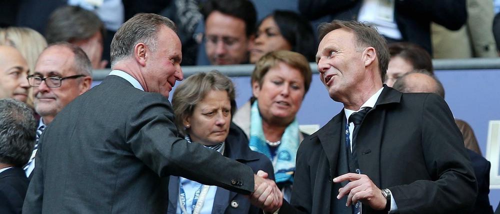 Wollen schnell wieder Bundesliga-Fußball: Bayern Karl-Heinz Rummenigge (l.) und Dortmunds Hans-Joachim Watzke (r.). 