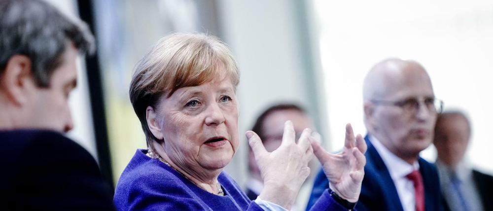 Markus Söder, Angela Merkel, Peter Tschentscher.
