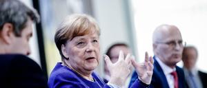 Markus Söder, Angela Merkel, Peter Tschentscher.