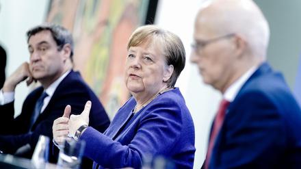 Markus Söder, Angela Merkel, Peter Tschentscher.