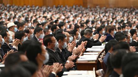 Einheit geboten. China klatscht sich beim Volkskongress aus der Krise.
