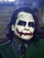 Maske des Grauens. Ein Fan verkleidet sich zur Premiere von "The Dark Knight Rises" als der anarchische Joker.