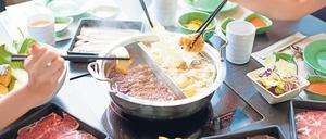 Üppiges Fondue. In China wird meist großzügig aufgetischt. Das soll sich ändern. 