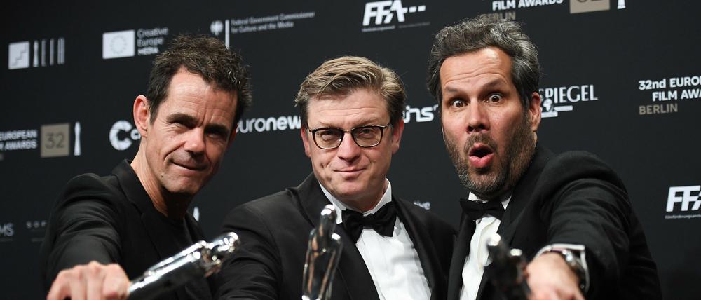 Preisträger des letzten Jahrgangs. Die Regisseure Tom Tykwer, Hendrik Handloegten und Achim von Borries.