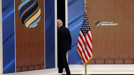 U.S. President Joe Biden leaves after delivering closing remarks with leaders from democratic nations at the State Department's virtual Summit for Democracy, in a speech from the Eisenhower Executive Office Building's South Court Auditorium at the White House in Washington, U.S., December 10, 2021. REUTERS/Leah Millis