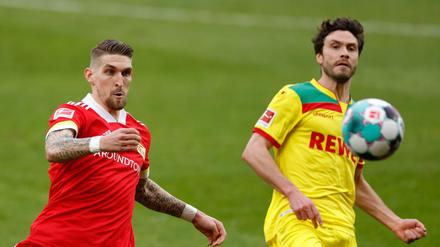 Robert Andrich (links) gewann mit dem 1. FC Union am Samstag 2:1 gegen Köln (rechts Jonas Hector).