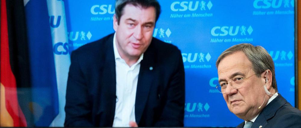 Im Duell um die Kanzlerkandidatur: Markus Söder (l) und Armin Laschet.