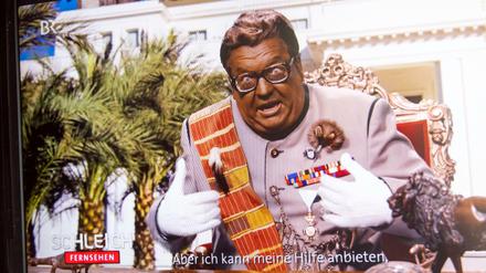 Satiriker Helmut Schleich mimt einen vermeintlichen Maxwell Strauß, der als schwarzer Despot Tipps zur Corona-Pandemie gibt.
