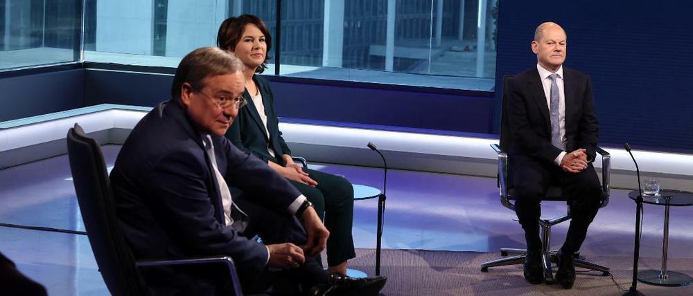 Wer nimmt den Bürger die Furcht vor zu schneller und zu teurer Veränderung? Die Kanzlerkandidaten Armin Laschet, Annalena Baerbock und Olaf Scholz. 