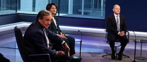 Wer nimmt den Bürger die Furcht vor zu schneller und zu teurer Veränderung? Die Kanzlerkandidaten Armin Laschet, Annalena Baerbock und Olaf Scholz. 
