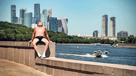 Stolze Skyline. Zum neuen urbanen Konzept gehören Parks wie hier an der Moskwa, im Hintergrund das internationale Businesszentrum „Moskwa City“.