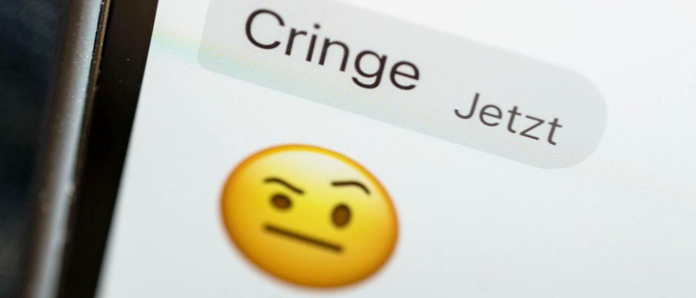 „Cringe“ auf dem Display eines Mobiltelefons
