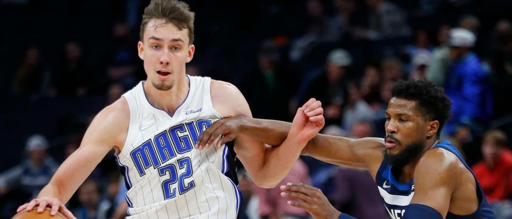 Nov 1, 2021; Minneapolis, Minnesota, USA; Orlando Magic forward Franz Wagner (22) works around Minnesota Timberwolves guard Malik Beasley (5) at Target Center. Mandatory Credit: Bruce Kluckhohn-USA TODAY Sports