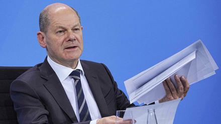 Olaf Scholz wird wohl der nächste Bundeskanzler. Hier präsentiert er nicht den Koalitionsvertrag, sondern die neuen Coronamaßnahmen.