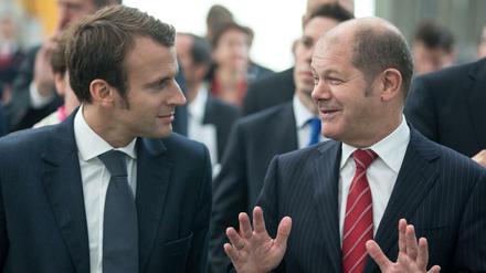 Alte Bekannte. Ex-Wirtschaftsminister Macron (links) und Hamburgs früherer Bürgermeister Scholz bei einer Begegnung 2014.