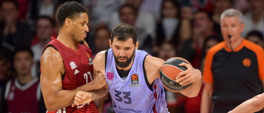 Harte Arbeit für den Topstar. Nikola Mirotic (rechts) hat in der Serie gegen Bayern (l. Augustine Rubit) bisher nicht sonderlich viel Spaß.