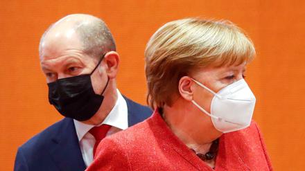 Olaf Scholz (SPD) und die damalige Kanzlerin Angela Merkel (CDU) im Januar 2021 