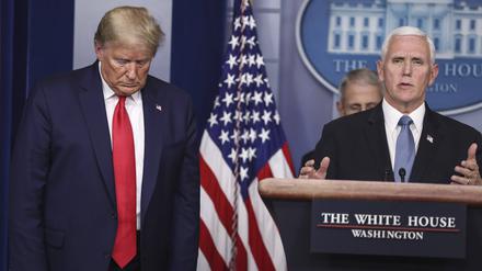  United States Vice President Mike Pence speaks as US President Donald J.Trump listens during a press conference with members of the coronavirus task force in the Brady Press Briefing Room of the White House on March 24, 2020 in Washington, DC. PUBLICATIONxNOTxINxUSA Copyright: xOliverxContrerasx