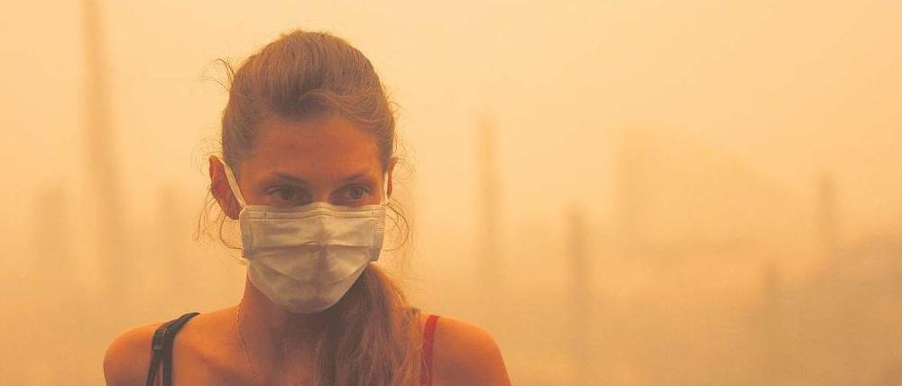 In Moskau und in anderen in der Nähe gelegenen Städten schützen sich die Menschen vor dem beißenden Rauch.