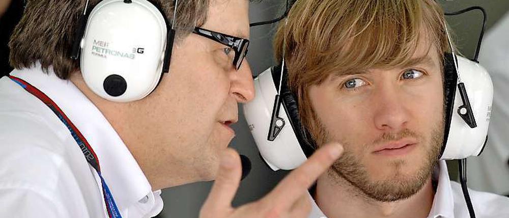 Nick Heidfeld (r.) und Mercedes-Benz-Motorsportchef Norbert Haug.