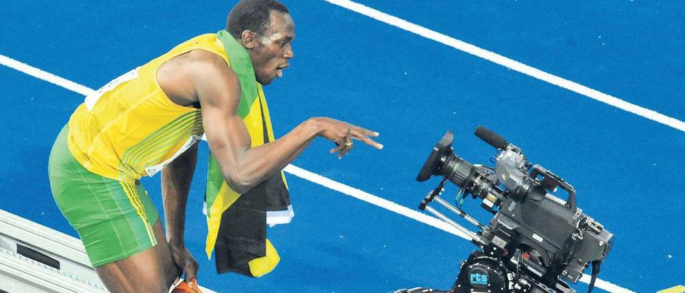 Berlin, Olympiastadion, August 2009. Ausnahmesprinter Usain Bolt posiert nach dem Sieg in der Sprint-Staffel. Solche Live-Momente werden die Zuschauer bei der nächsten Leichtathletik-WM via ARD und ZDF wahrscheinlich nicht sehen können. Foto: ddp