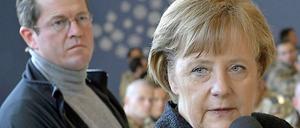 Stimme seiner (Ex-)Herrin: Angela Merkel macht Karl-Theodor zu Guttenberg eine klare Ansage.