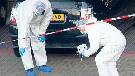 Mitarbeiter der Spurensicherung am Ort des Amoklaufs. Foto: dpa
