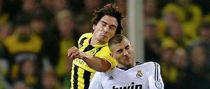 Achtung, Höhenrausch! Anders als in den vergangenen Jahren spielt Dortmund (hier Mats Hummels/links gegen Real Madrids Karim Benzema) bei den Festtagen in der Champions League eine Klasse besser als im Bundesliga-Alltag.