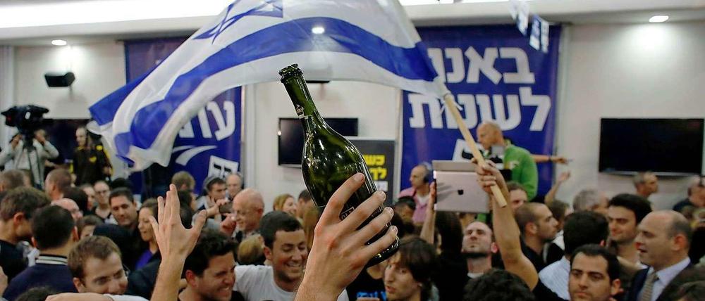 In Feierlaune: Anhänger der zentristischen Partei von Yair Lapid, die überraschend viele Sitze in der Knesset erringen konnte.