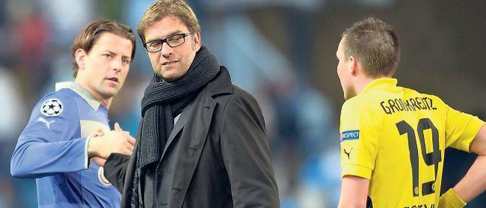 Schwer zu deuten. Die Dortmunder (hier Trainer Klopp mit Weidenfeller und Großkreutz) hadern zwar mit dem 0:0 aus dem Hinspiel, glauben aber ans Weiterkommen. 