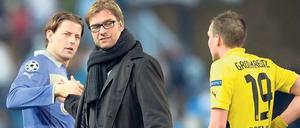 Schwer zu deuten. Die Dortmunder (hier Trainer Klopp mit Weidenfeller und Großkreutz) hadern zwar mit dem 0:0 aus dem Hinspiel, glauben aber ans Weiterkommen. 