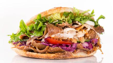 close up of kebab sandwich on white background