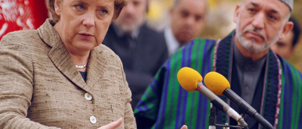 071103merkel_karsai