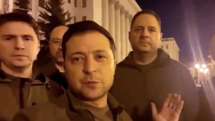 February 25, 2022, Kyiv, Ukraine: Ukrainian President VOLODYMYR ZELENSKY, surrounded by several top officials, addressed the country Friday night local time from the doorstep of the presidential administration in central Kyiv to show he and other leaders haven't fled the capital. (Credit Image: © Ukrainian President's Office/ZUMA Press Wire Service