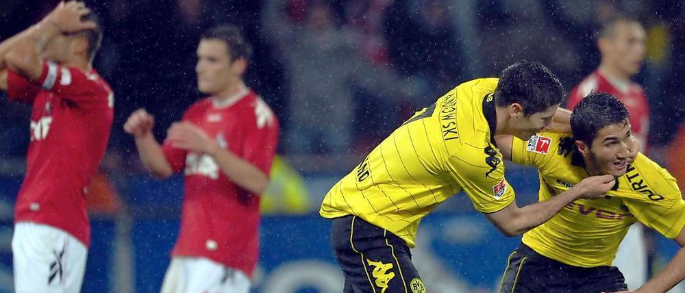 Keiner kann es fassen: Die Kölner nicht, dass sie den einen Punkt noch hergeschenkt haben und Lewandowski (M.) nicht den Torschützen Sahin.