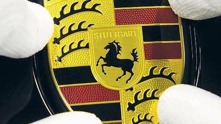 Gut platziert. Porsche gibt bis zu 131,25 Millionen Aktien zu je 38 Euro aus. Von den Familien Porsche und Piëch kommen 2,25 Milliarden Euro, von Katar 250 Millionen Euro. Foto: dpa