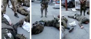 Das Video zeigt verwundete Gefangene sowie Schüsse auf teils gefesselte Personen, die aus einem Kleinbus aussteigen.