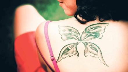 Eingefleischte Evolutionsforschung. Das Tattoo der Biologin Duygu Özpolat zeigt die Finkenarten, die Darwin auf den Galapagosinseln einsammelte.