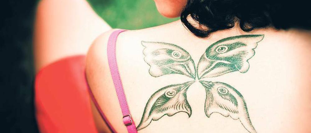 Eingefleischte Evolutionsforschung. Das Tattoo der Biologin Duygu Özpolat zeigt die Finkenarten, die Darwin auf den Galapagosinseln einsammelte.