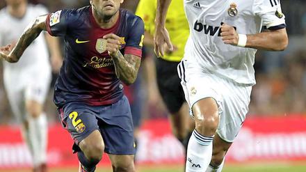 Zwei in einer Elf. Im Alltag sind Dani Alves (links) und Cristiano Ronaldo Gegner. Am Montag standen Barcelonas brasilianischer Verteidger und Reals portugiesischer Stürmer virtuell in einer gemeinsamen Mannschaft. 